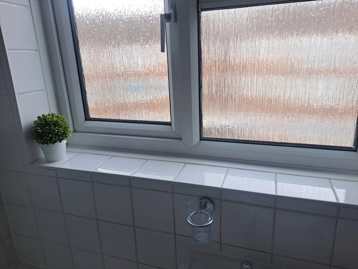 A window, frame and sill cleaned to a streak free finish